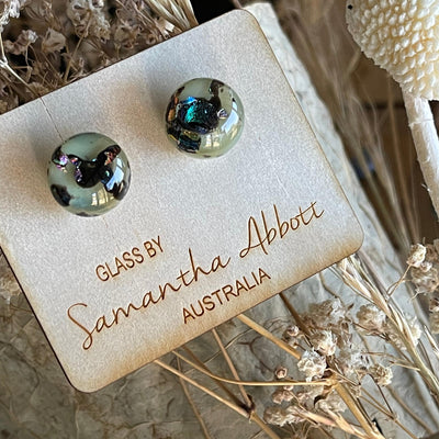 Earthy greens with black sparkles